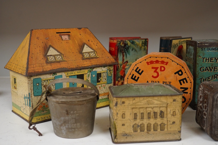 A quantity of various painted tin money boxes including Lucie Attwell Fairy House, The ‘Daily Mail’ copper bank, and four in the form of books, largest 20cm high. Condition - mostly fair